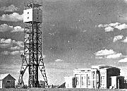 [09:25] – стальная башня высотой 37 м в центре поля и мастерская, в которой производился монтаж изделия